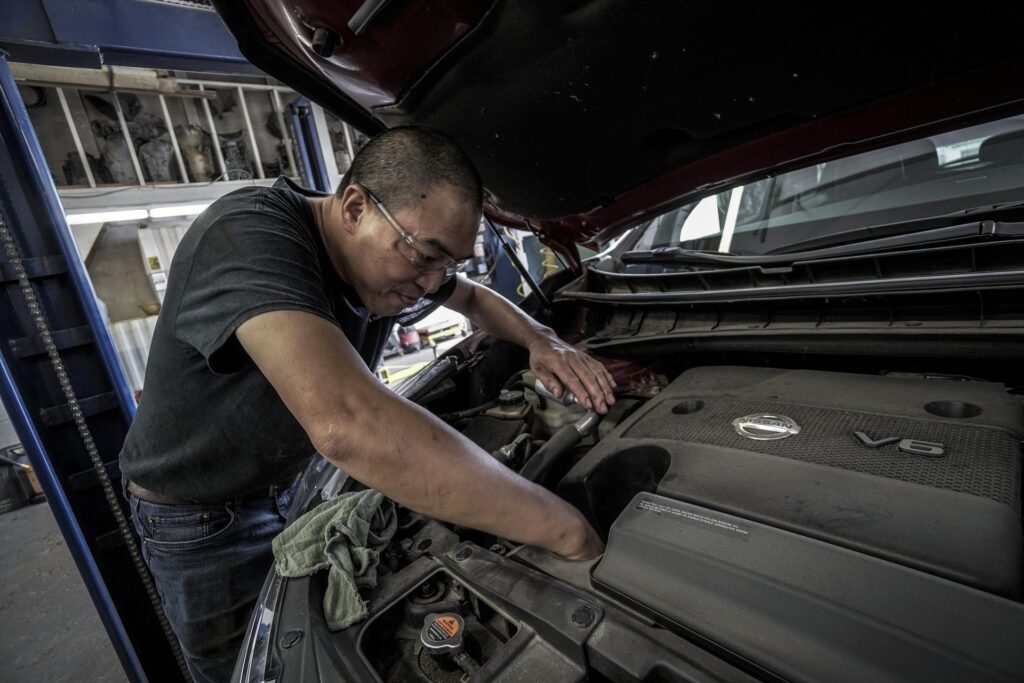 Service van or technician working on a vehicle outdoors